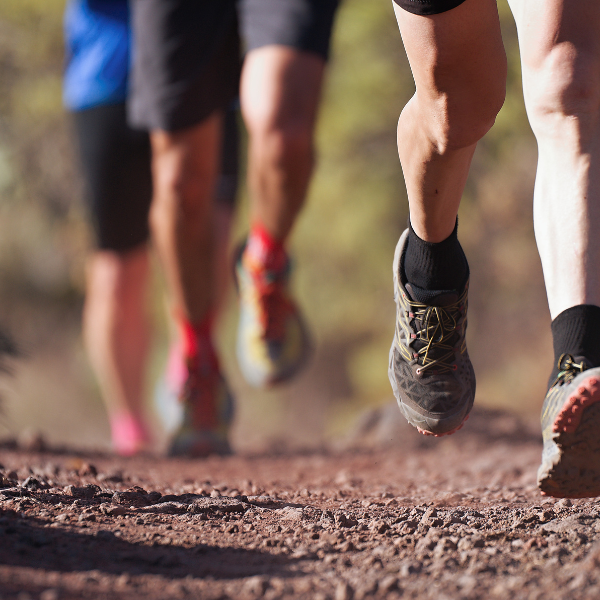 Runners running shoes on trail run